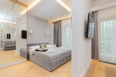Łóżko lub łóżka w pokoju w obiekcie Mennica Residence - City Center Apartments by Noclegi Renters