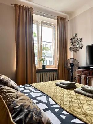 Łóżko lub łóżka w pokoju w obiekcie Africa Apartment