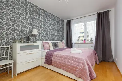 Łóżko lub łóżka w pokoju w obiekcie Atrium Ursus Warsaw Apartments by Noclegi Renters