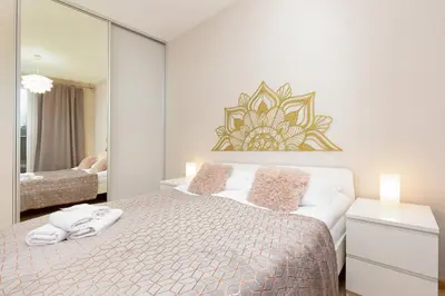 Łóżko lub łóżka w pokoju w obiekcie Espace Wilanów Apartments by Noclegi Renters