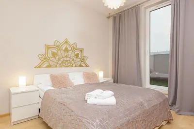 Łóżko lub łóżka w pokoju w obiekcie Espace Wilanów Apartments by Noclegi Renters