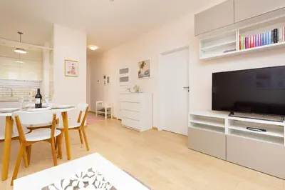 Telewizja i/lub zestaw kina domowego w obiekcie Espace Wilanów Apartments by Noclegi Renters