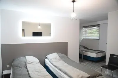 Łóżko lub łóżka w pokoju w obiekcie KOMFORT SUTERENA