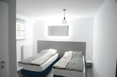 Łóżko lub łóżka w pokoju w obiekcie KOMFORT SUTERENA