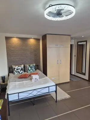 Łóżko lub łóżka w pokoju w obiekcie City View Studio Chmielna