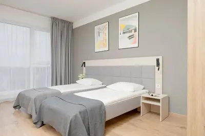 Łóżko lub łóżka w pokoju w obiekcie Business Studio Apartments Wolska by Noclegi Renters