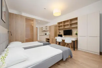 Łóżko lub łóżka w pokoju w obiekcie Business Studio Apartments Wolska by Noclegi Renters