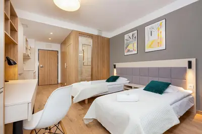 Łóżko lub łóżka w pokoju w obiekcie Business Studio Apartments Wolska by Noclegi Renters