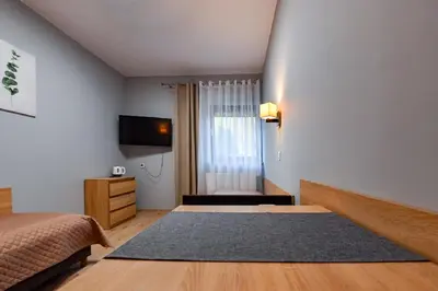 Łóżko lub łóżka w pokoju w obiekcie Fotex