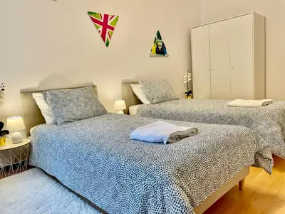 Łóżko lub łóżka w pokoju w obiekcie Warsaw Concierge Wola Ratusz