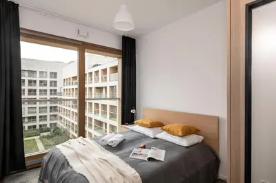 Łóżko lub łóżka w pokoju w obiekcie ShortStayPoland Kolejowa (B52)