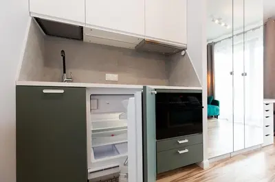 Kuchnia lub aneks kuchenny w obiekcie Cozy apartment Jana Kazimierza, Wola