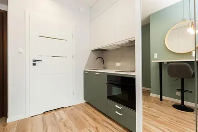 Kuchnia lub aneks kuchenny w obiekcie Cozy apartment Jana Kazimierza, Wola