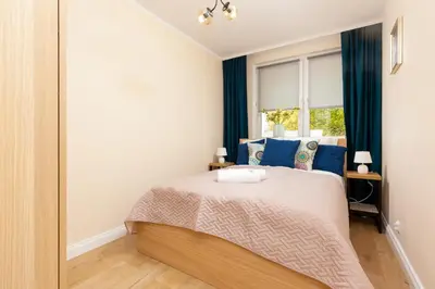Łóżko lub łóżka w pokoju w obiekcie Apartments City Center Ochota by Noclegi Renters