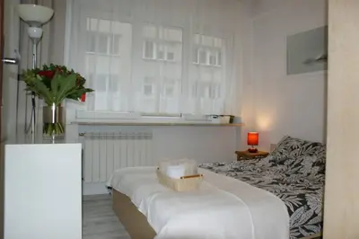 Łóżko lub łóżka w pokoju w obiekcie City center- large apartment with National Musee view