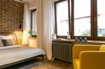 Łóżko lub łóżka w pokoju w obiekcie Green Żoliborz Apartment