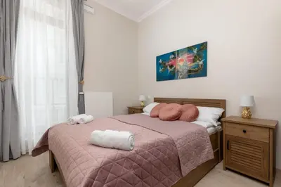 Łóżko lub łóżka w pokoju w obiekcie Aleja Solidarności 60B II by Noclegi Renters