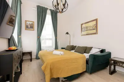 Łóżko lub łóżka w pokoju w obiekcie Aleja Solidarności 60B II by Noclegi Renters