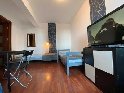 Telewizja i/lub zestaw kina domowego w obiekcie Pokoje PANORAMA CITY VIEW- Centrum