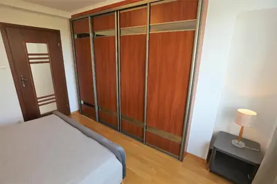 Łóżko lub łóżka w pokoju w obiekcie Apartament MGM Karmelicka