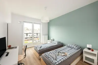 Łóżko lub łóżka w pokoju w obiekcie Pokoje Sonaty