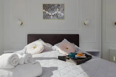Łóżko lub łóżka w pokoju w obiekcie Apartamenty Ogrodowa Business Wola by Renters Prestige