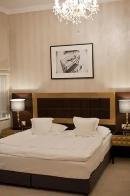 Łóżko lub łóżka w pokoju w obiekcie Tiffi Old Town Hotel