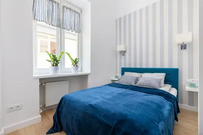 Łóżko lub łóżka w pokoju w obiekcie Apartament Królewska by Your Freedom