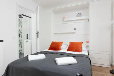 Łóżko lub łóżka w pokoju w obiekcie Studio Apartment Ochota Siemieńskiego by Noclegi Renters