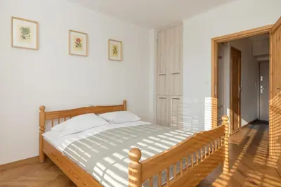 Łóżko lub łóżka w pokoju w obiekcie Piękna 2-Bedroom Apartment by BookingHost