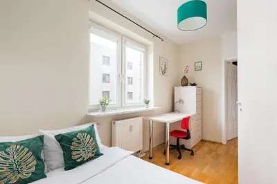 Łóżko lub łóżka w pokoju w obiekcie Metro Młynów Pleasant Apartament by BookingHost