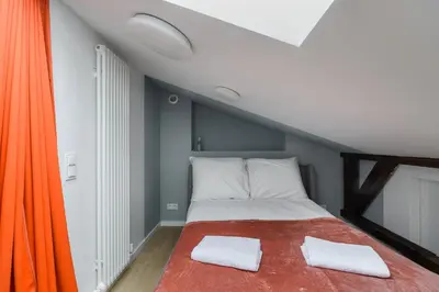 Łóżko lub łóżka w pokoju w obiekcie Zoliborz P&O Serviced Apartments