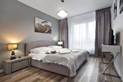 Łóżko lub łóżka w pokoju w obiekcie Goclaw P&O Serviced Apartments
