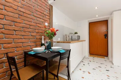 Kuchnia lub aneks kuchenny w obiekcie Mezzanine Studio Lwowska Śródmieście by Noclegi Renters