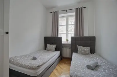 Łóżko lub łóżka w pokoju w obiekcie Warsaw Premium Apartments Standard Old Town