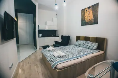 Łóżko lub łóżka w pokoju w obiekcie YOURAPART STARÓWKA z JACUZZI