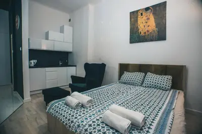 Łóżko lub łóżka w pokoju w obiekcie YOURAPART STARÓWKA z JACUZZI