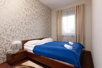 Łóżko lub łóżka w pokoju w obiekcie Apartments Chełmońskiego Warsaw Ursus by Noclegi Renters