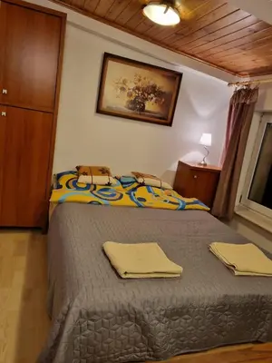 Łóżko lub łóżka w pokoju w obiekcie Stylowe poddasze