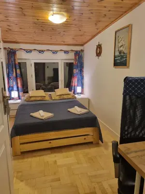 Łóżko lub łóżka w pokoju w obiekcie Stylowe poddasze