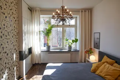 Łóżko lub łóżka w pokoju w obiekcie Apartament Powiśle