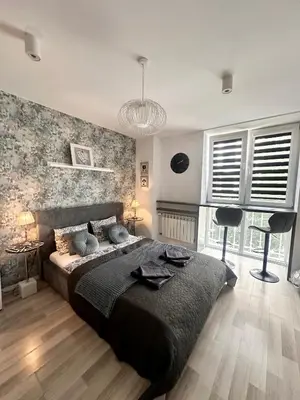 Łóżko lub łóżka w pokoju w obiekcie Nice Stay Apartment Centrum