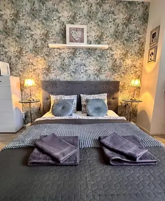 Łóżko lub łóżka w pokoju w obiekcie Nice Stay Apartment Centrum