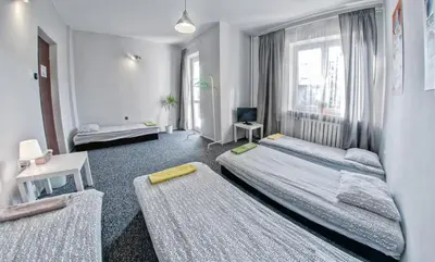 Łóżko lub łóżka w pokoju w obiekcie Place4Us