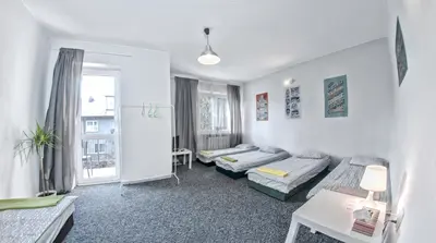 Łóżko lub łóżka w pokoju w obiekcie Place4Us