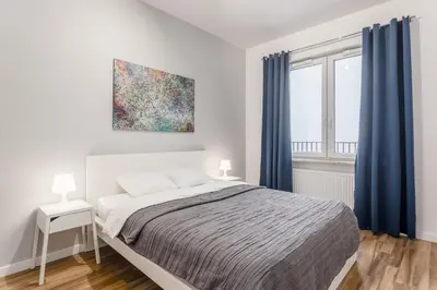 Łóżko lub łóżka w pokoju w obiekcie Warsaw City Travel Apartments