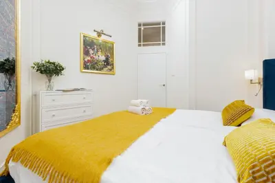 Łóżko lub łóżka w pokoju w obiekcie Royal Apartment Kopernika by Renters Prestige