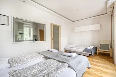 Łóżko lub łóżka w pokoju w obiekcie Labo Apartment Ogrodowa