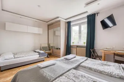 Łóżko lub łóżka w pokoju w obiekcie Labo Apartment Ogrodowa