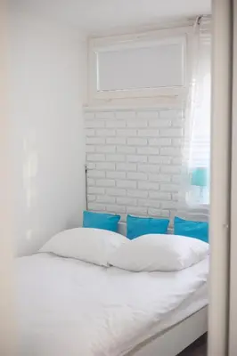 Łóżko lub łóżka w pokoju w obiekcie Rondo ONZ Business Apartment by BookingHost